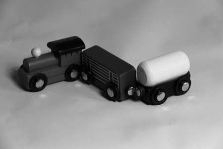 Photo in black and white of a toy train on a white backgroundの写真素材