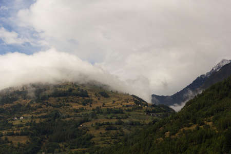 Photos of mountains with mist, in the Val d'Aostaの写真素材