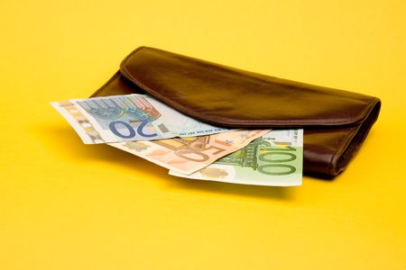 Old brown pocket with money