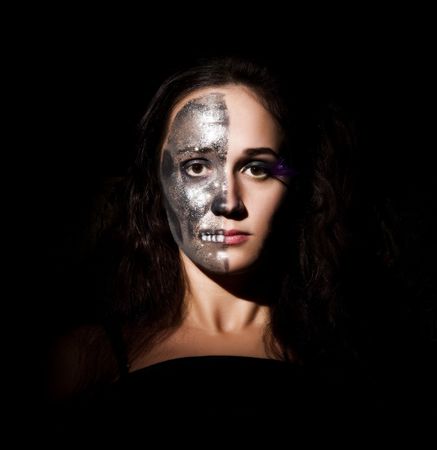 Two-faced girl looking to the cameraの写真素材