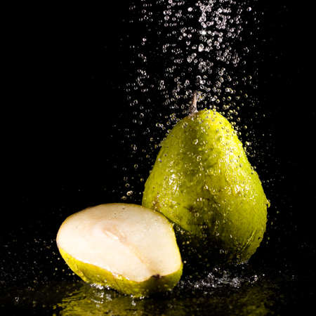 Pear under sparking water splashesの写真素材