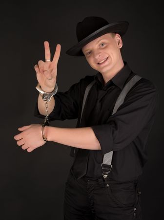 Young man in the handcuffs smiling