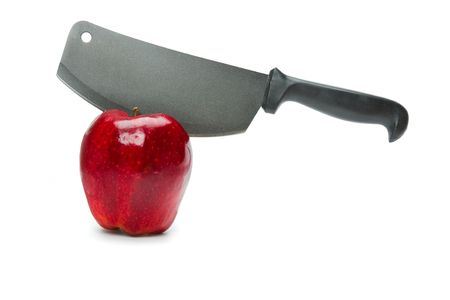 A knife in a red appleの写真素材