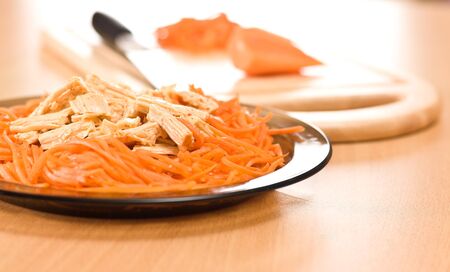 Carrot and knife and cut saladの写真素材