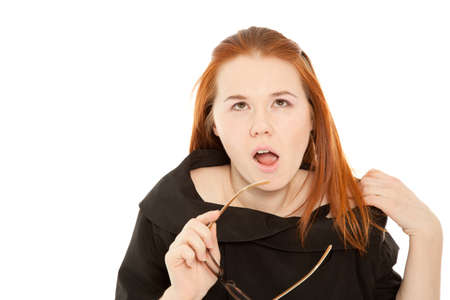 Surprised woman with glasses isolated on whiteの写真素材