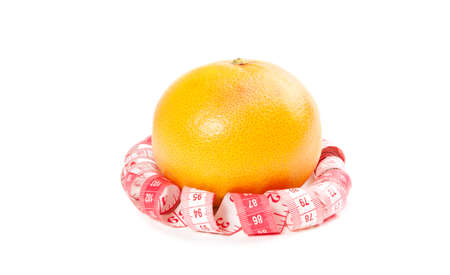 Picture of orange and measure tape on the white backgroundの写真素材