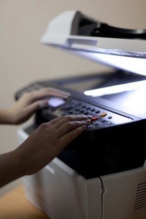 Woman s hands with copier turned on