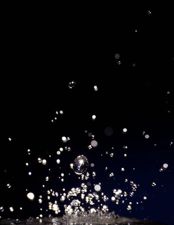 Splash of clear water on dark backgroundの写真素材