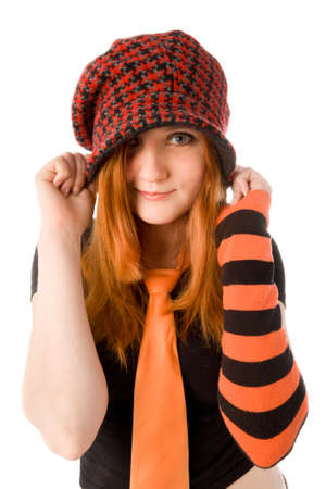 Red haired girl in knit hat isolated on whiteの写真素材