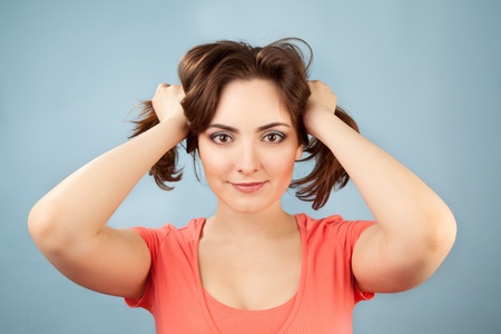 Portrait of cheerful beautiful woman with two ponytailsの写真素材