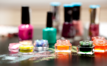 Colorful powder for nails on black backgroundの写真素材