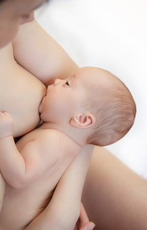 Picture of baby feeds mom's breastの写真素材