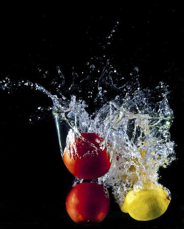 VEGETABLES SPLASH ON BLACKの写真素材