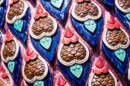 Thai style wall pattern in temple backgroundの写真素材