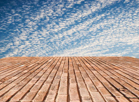 brick wall texture with blue sky backgroundの写真素材