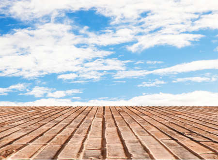 brick wall texture with blue sky backgroundの写真素材