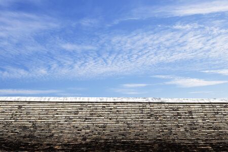 Thai style art on the roof in temple, blue sky, Thailandの写真素材