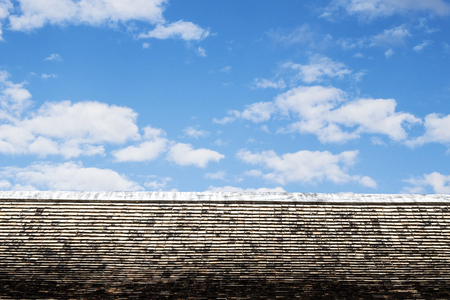 Thai style art on the roof in temple, blue sky, Thailandの写真素材
