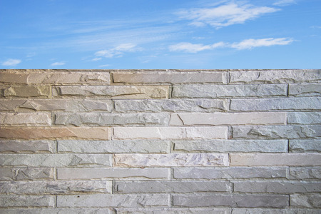 brick wall texture with blue sky backgroundの写真素材