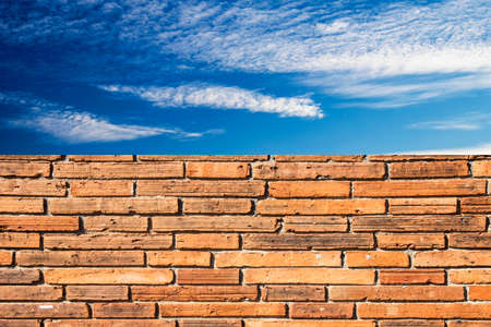 brick wall texture with blue sky backgroundの写真素材