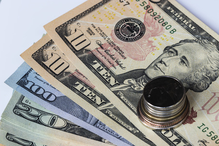 Bath coins on the dollars banknotes as backgroundの写真素材