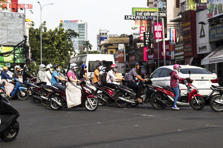 HOCHIMINH CITY, VIETNAM - February 24, 2017: Amazing traffic of Asia city, group citizen on privaet vehicle in rush hour, mob of people in helmets, riding motorcycles in Vietnam, February 24, 2017のeditorial素材