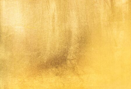 Shiny yellow leaf gold foil texture background