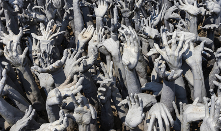 Hands Statue from Hell in Wat Rong Khun at Chiang Rai, Thailandのeditorial素材