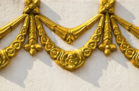 Ancient golden carving wooden window of Loas temple. Pakse Loas.の写真素材