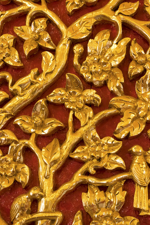 Traditional Thai carved gold pattern decorative in temple, Thailandの写真素材