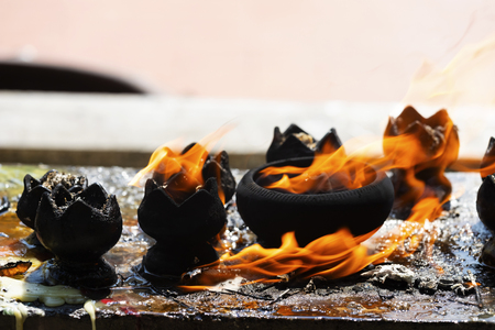 Candles in the temple. .Fire in lantern for pray with Buddha statue in temple.の写真素材