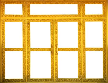 Carved patterns on gold wooden doors at thai temple. On white backgroundの写真素材