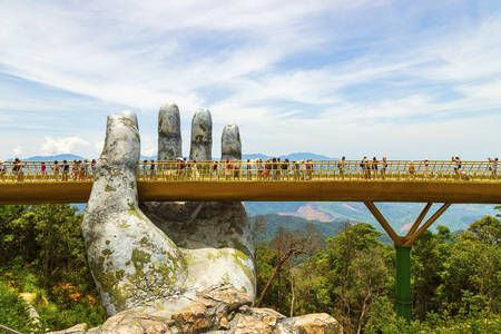Danang, Vietnam - JUNE, 24, 2019: The Golden Bridge in the Bana Valley, supported by a giant hand This bridge is 1,400 meters above sea level.のeditorial素材