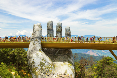 Danang, Vietnam - JUNE, 24, 2019: The Golden Bridge in the Bana Valley, supported by a giant hand This bridge is 1,400 meters above sea level.のeditorial素材