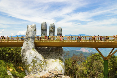 Danang, Vietnam - JUNE, 24, 2019: The Golden Bridge in the Bana Valley, supported by a giant hand This bridge is 1,400 meters above sea level.のeditorial素材