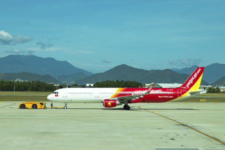 DANANG , VIETNAM - JUNE 26, 2019: The air plane VietJet Air company stands at the DANANG International Airport.のeditorial素材