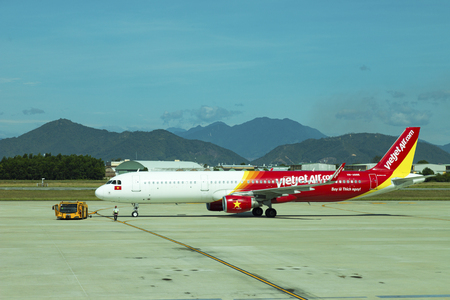 DANANG , VIETNAM - JUNE 26, 2019: The air plane VietJet Air company stands at the DANANG International Airport.のeditorial素材