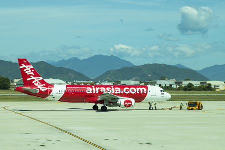DANANG , VIETNAM - JUNE 26, 2019: The air plane airasia airline company stands at the DANANG International Airport.のeditorial素材