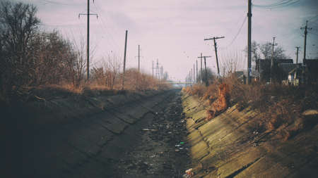 Dried water channel through the villageの写真素材