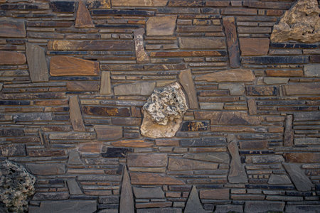 A stone wall made of polished stonesの写真素材