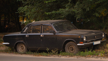 An old abandoned Soviet car near the road