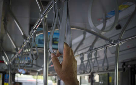 Help elderly people in public transport (We have to help everywhere and always)の写真素材