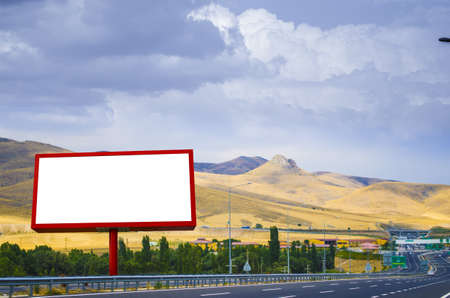Blank white billboard on the background of the highwayの写真素材