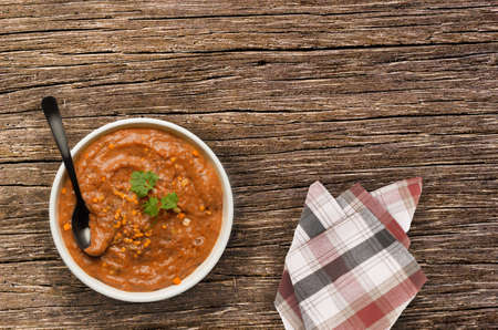 Red lentil soup on wooden tableの写真素材