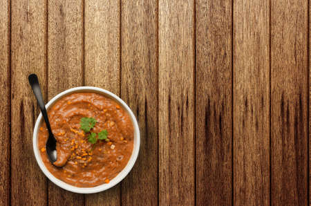Red lentil soup on wooden tableの写真素材