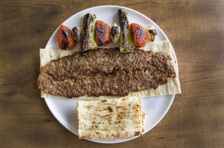 turkish adana kebab plate on wooden tableの写真素材