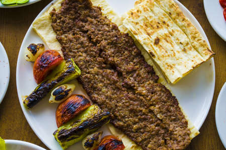 turkish adana kebab plate on wooden tableの写真素材