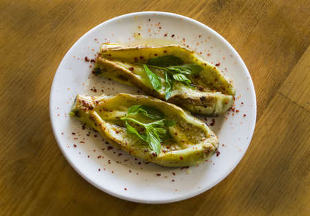Roasted eggplant plate on wooden tableの写真素材