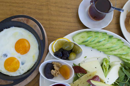 Breakfast plate on wooden tableの写真素材
