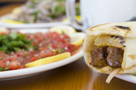 turkish and arabic traditional ramadan shish kebab roll wrap serving with yogurt aubergine saladの写真素材